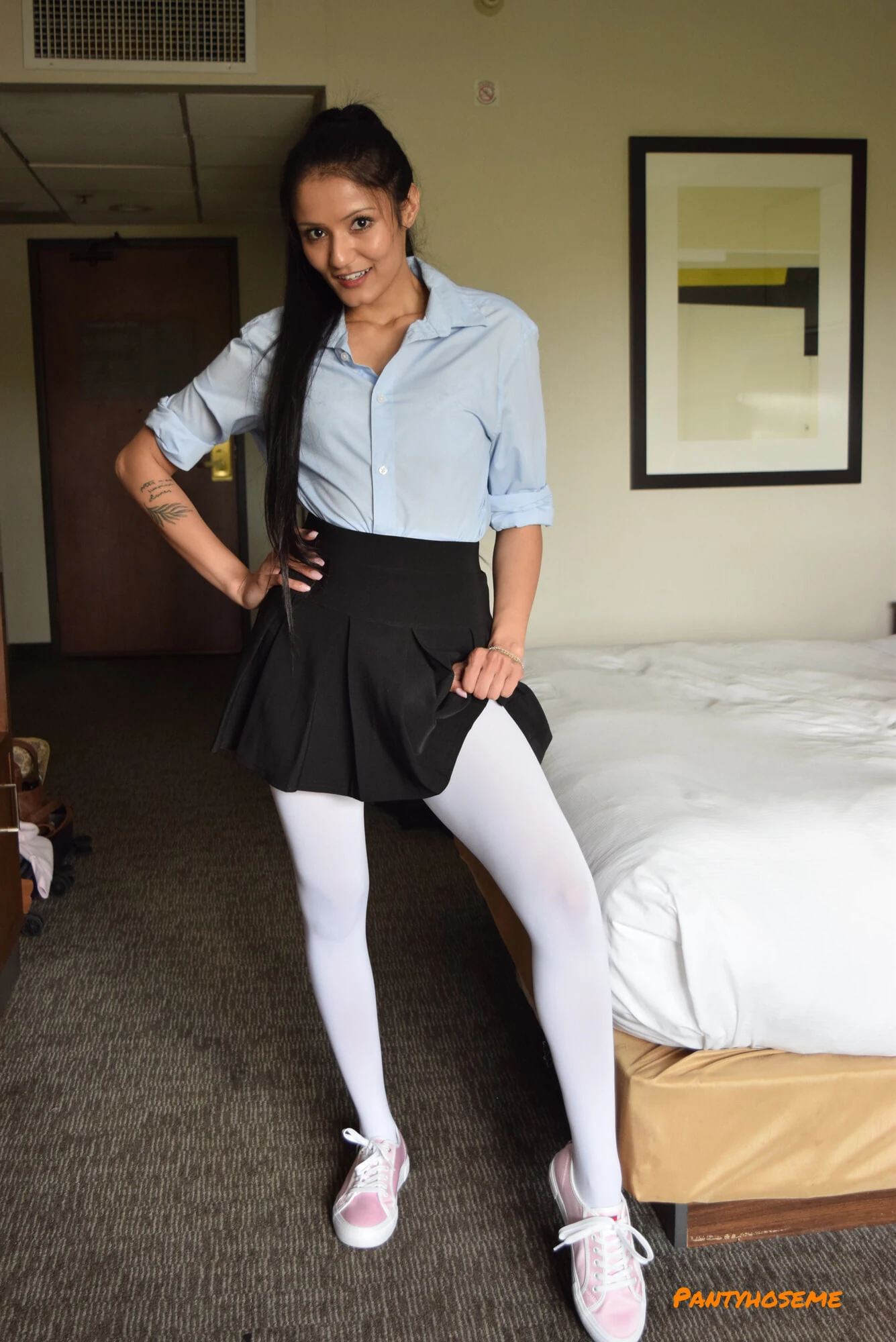Brunette In Pleated Skirt and White Pantyhose Stripping