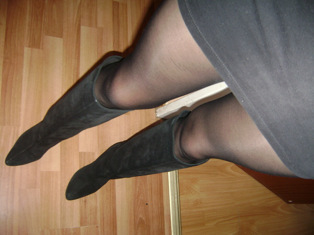 black tights, miniskirt, in heels and boots