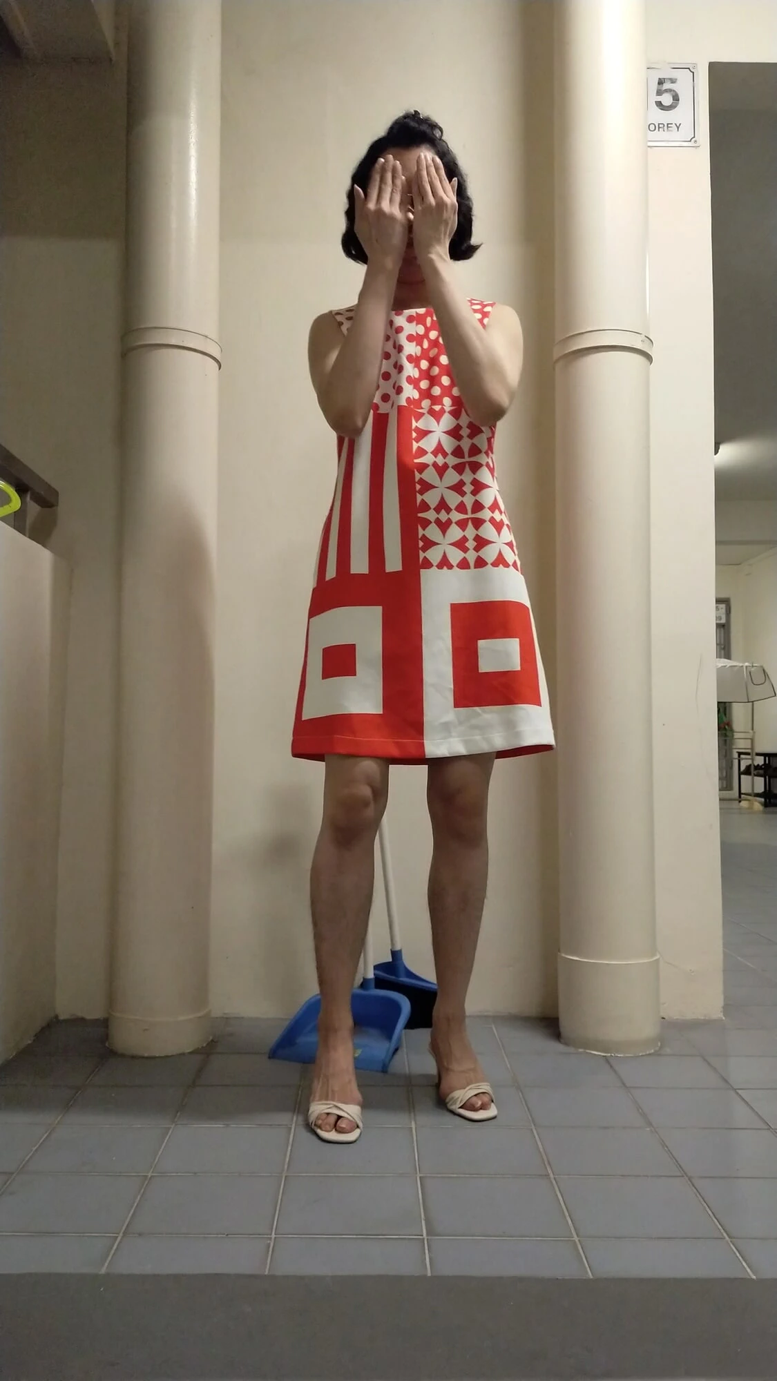 Secretly wearing someone chinese new year dress and heels.