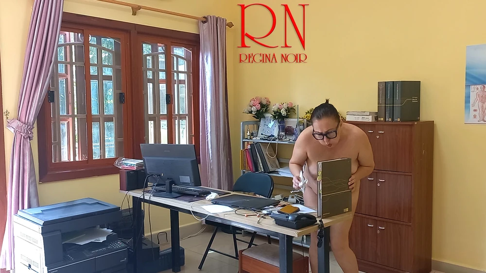 The naked secretary is cleaning up the office. Voyeur camera #3