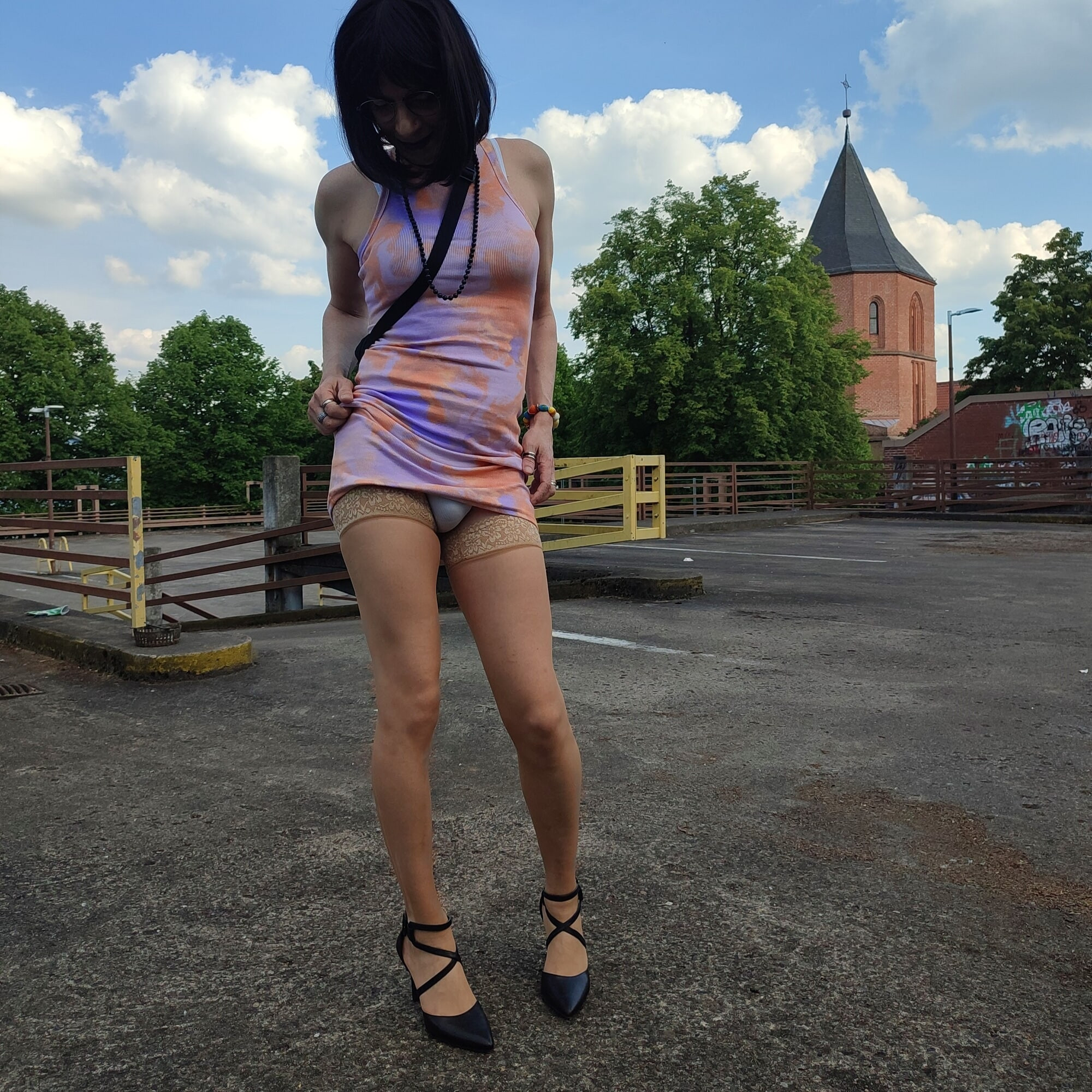 Me in a tight miniskirt on top a parkinghouse. 
