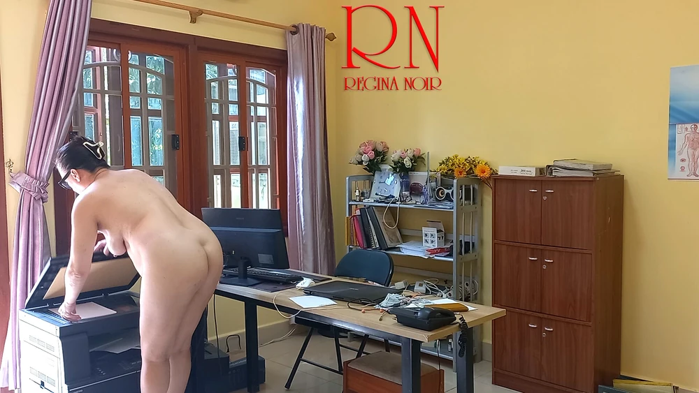 The naked secretary is cleaning up the office. Voyeur camera #4